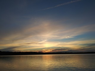 sunset landscape in the beach, with a blue sky,and a deep blue lake