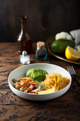 Fried noodles with chicken and avocado