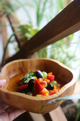Healthy fruit salad in wooden bowl