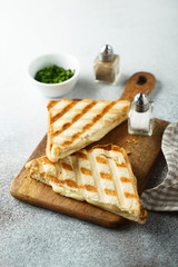 Grilled cheese sandwiches on wooden desk