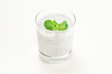 Chia pudding with mint on a white background. Space for text or design.