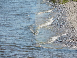waves of river on the beach in Saint-Petersburg