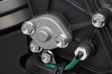 Close up thermostat and engine temperature sensor of boat outboard motor, repair and maintenance of the cooling system, overheating, emergency lamp operation