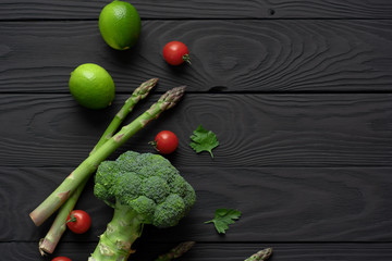 Asparagus pods, lime, tomato, green broccoli and and parsley leaves