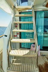 Obraz na płótnie Canvas Wooden gangway on a luxury yacht to the upper deck Red Sea