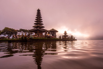 Naklejka premium Pura Ulun Danu Beratan, or Pura Bratan, is a major Shaivite water temple on Bali, Indonesia. The temple complex is located on the shores of Lake Bratan in the mountains near Bedugul