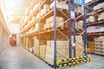 Blur Warehouse inventory product stock for logistic background, Long shelves with a variety of...