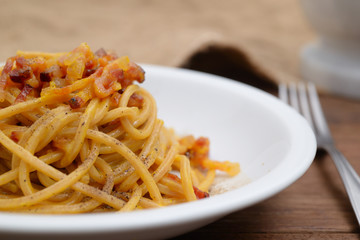 traditional italian dish,  spaghetti carbonara with bacon, egg, aged parmesan