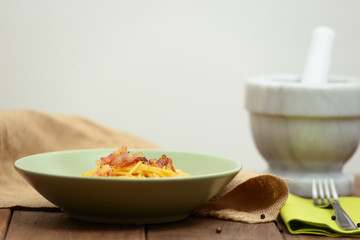 traditional italian dish,  spaghetti carbonara with bacon, egg, aged parmesan