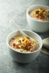 Homemade chowder soup in white bowls