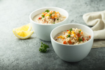 Homemade chowder soup in white bowls