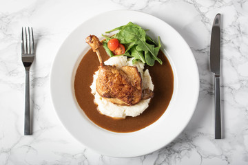 duck leg confit with demiglass sauce and mashed potato
