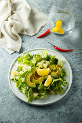 Healthy avocado salad with lemon dressing
