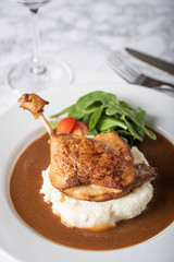 duck leg confit with demiglass sauce and mashed potato