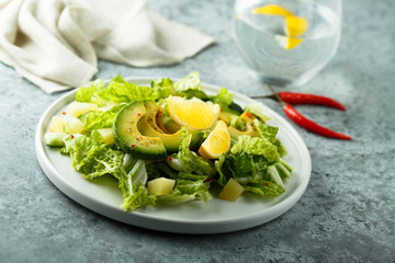 Healthy avocado salad with lemon dressing