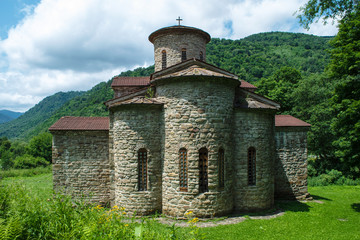 10th century ancient Christian church, Nizhnearhizy temples, Northern Zelenchuk temple, stone temple among mountains and vegetation