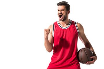 excited athletic basketball player in uniform with ball Isolated On White with copy space - obrazy, fototapety, plakaty