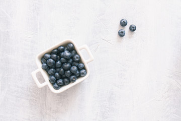 Fresh raw blueberries. Overhead, top view or above view composition with copy space