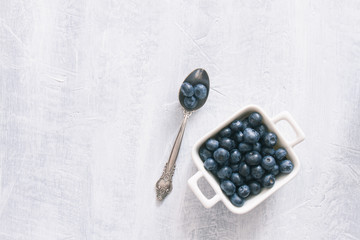 Fresh raw blueberries. Overhead, top view or above view composition with copy space