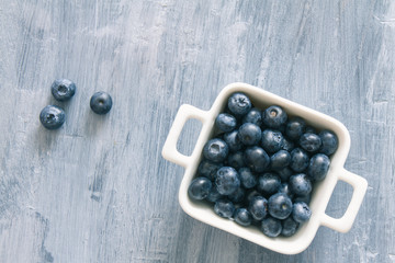 Fresh raw blueberries. Overhead, top view or above view composition with copy space