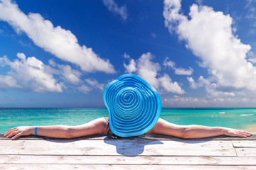 Fototapeta na wymiar Woman in hat at beautiful Caribbean sea, Mexico