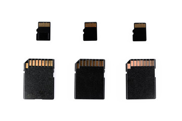 three sd cards and three micro sd isolated in white background