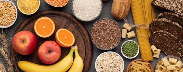 Various gluten free products and grains on wooden background