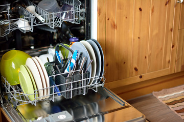 opened dishwasher with clean dishes
