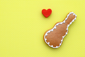 Music creative composition with gingerbread guitar on bright yellow background, copy space for text