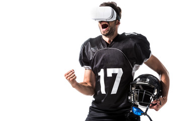 excited American Football player in virtual reality headset with helmet Isolated On White