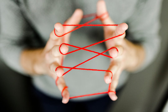 Close-up of man holding string