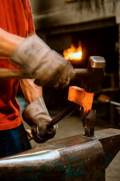 Blacksmith forging hatchet