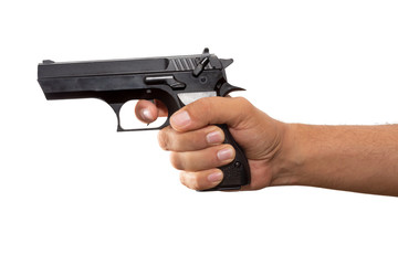 Hand holding a real gun on white background