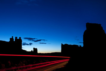 A beautiful blue hour silhouette of the famous Gossips and Organ Rock formations of Arches National Park, Utah.
