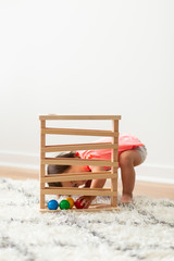 Toddler Girl Playing and Exploring with Montessori Lessons