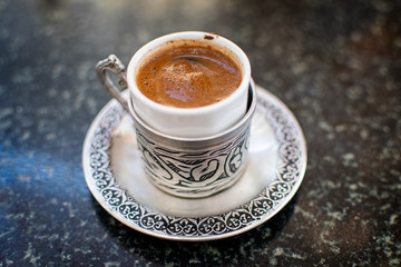 Traditional Turkish Coffee served in beautiful metal dish in Izmir in Turkey.
