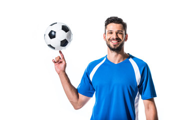 smiling handsome soccer player spinning on finger ball Isolated On White © LIGHTFIELD STUDIOS