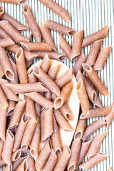 raw penne pasta close up