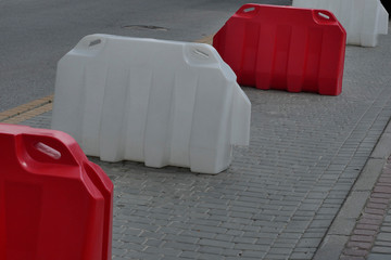 Plastic fencing of the carriageway.