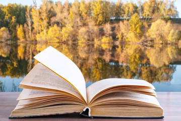 open book on the background of nature