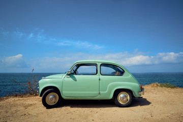 Fototapeta na wymiar antique car in the ocean coast
