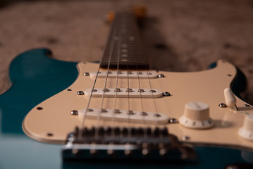 Electric guitar on a wooden background.
