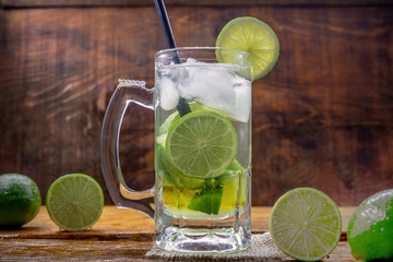 Beer caipirinha. Brazilian exotic drink of beer with lemon and cachaça.