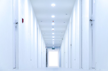 Clean white corridor of the condo