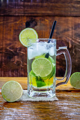 Beer caipirinha. Brazilian exotic drink of beer with lemon and cachaça.