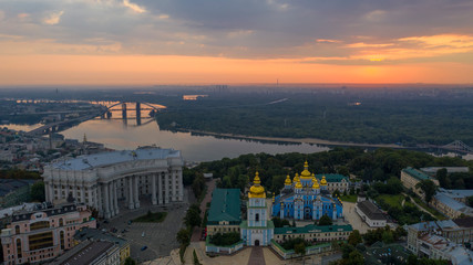 Fototapeta na wymiar Beautiful Golden Kiev Ukraine St. Michael's Golden-Domed Monastery. View from above. aerial video footage. Landscape city view to Dnipro