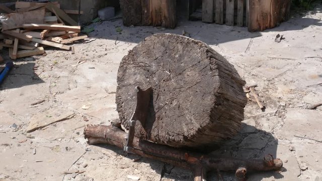 Throwing an old hunting axe to the tree stump. Hitting the target. Tournament. Training. Killer workout. Flying ax. Close up