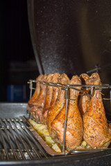 Close Up of Chicken Drumsticks covered by Seasoning Roasted in the Grill