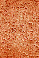 textured background with space for text. Texture rough plaster on the wall of concrete. Orange