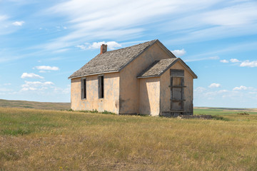 Fototapeta na wymiar Abandoned One Room School on a Hilltop in Cypress County, Alberta, Canada